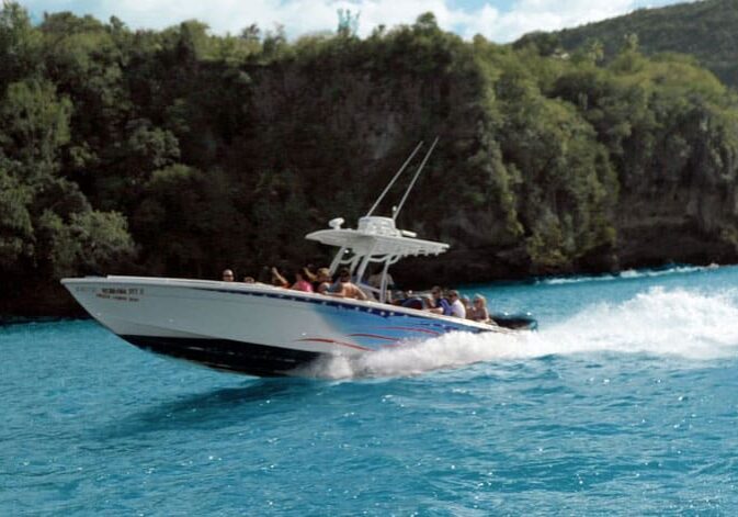 Spencer's speedboat speeds along the scenic coast of St. Lucia on a Speedboat Tours, Spencer Ambrose Tours